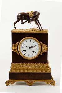 An Empire Style Gilt and Patinated Bronze Mantel Clock