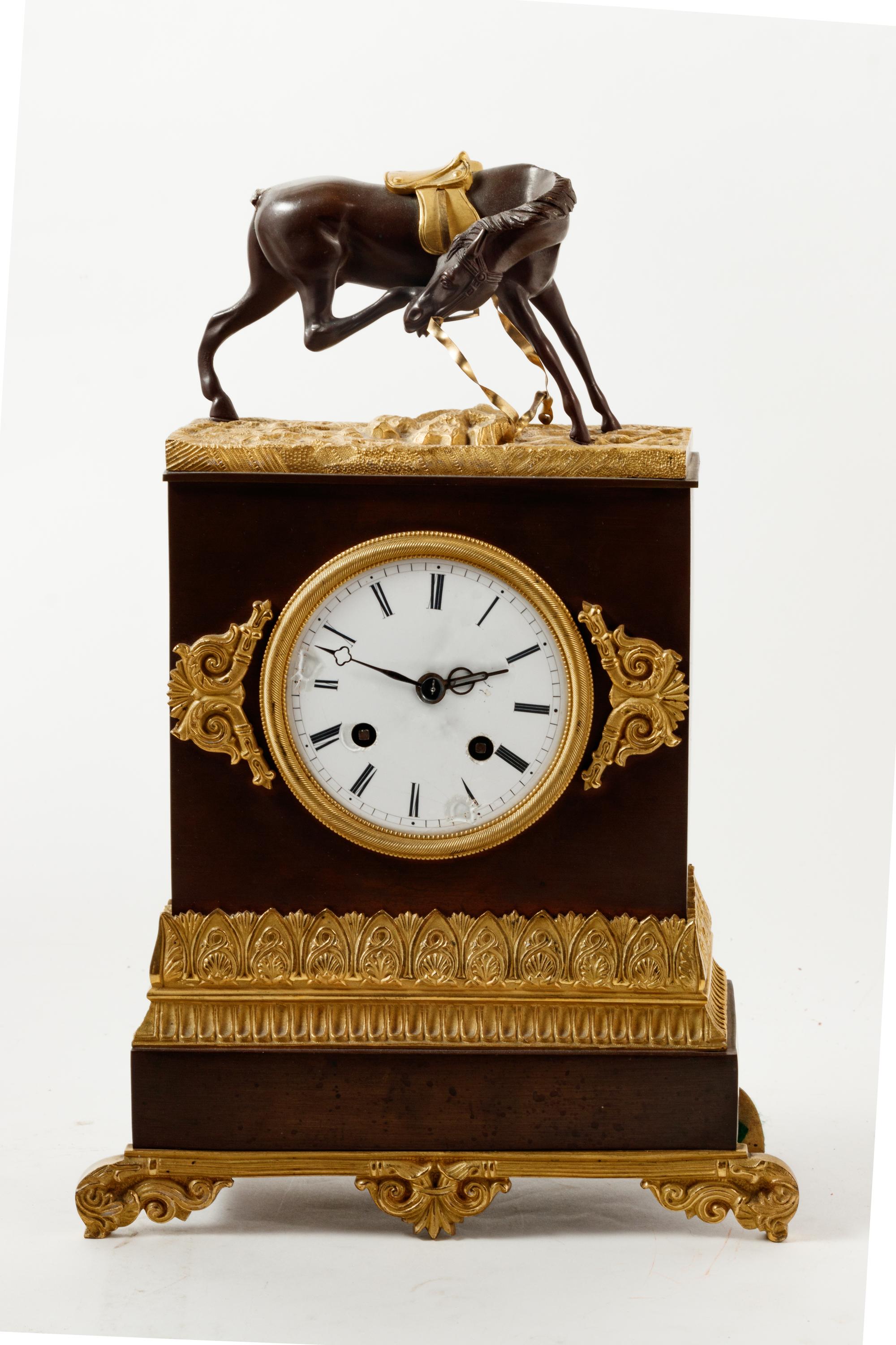 An Empire Style Gilt and Patinated Bronze Mantel Clock
