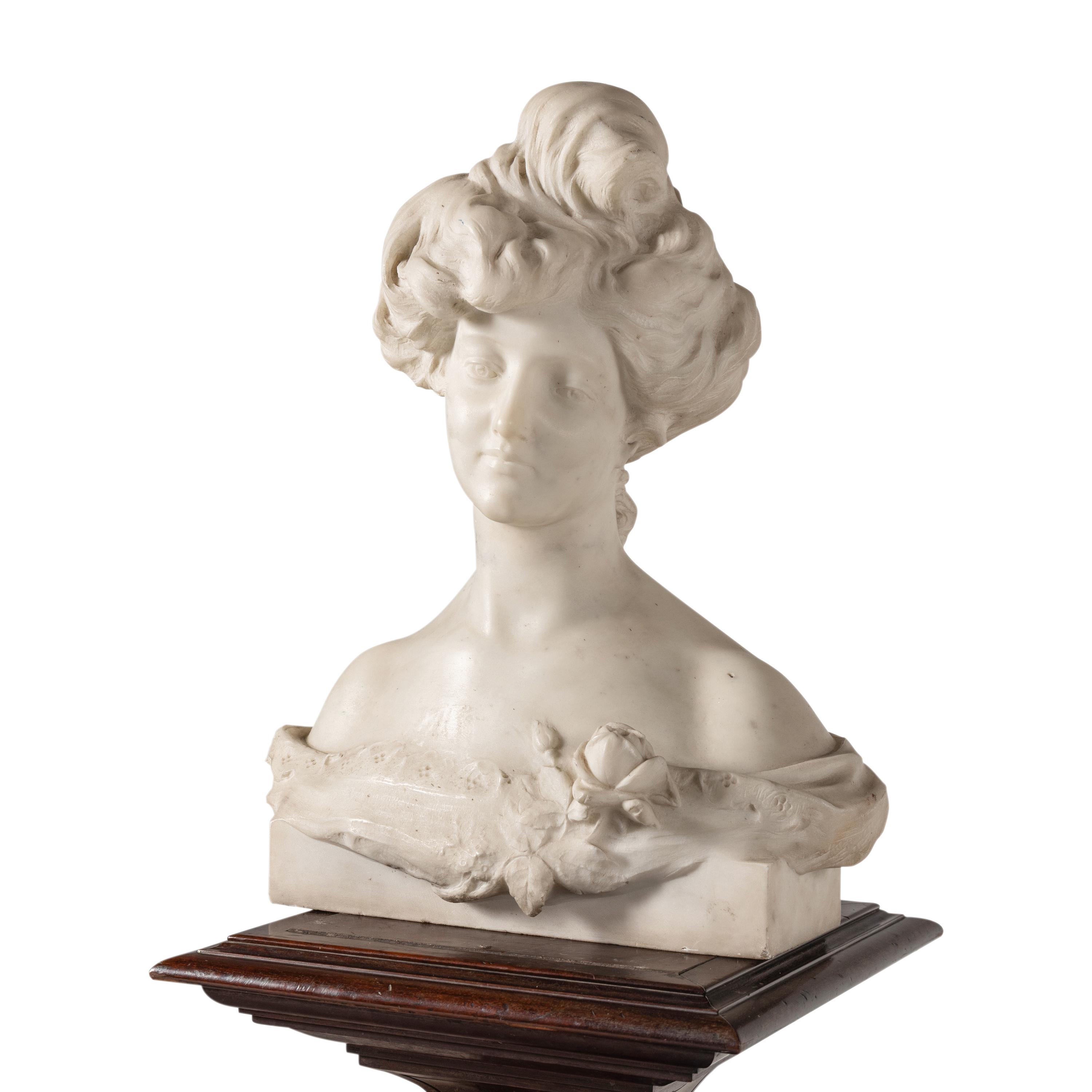 An Italian Carved Marble Bust of a Young Woman