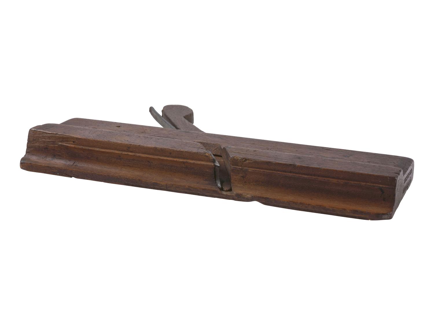 [AFRICAN AMERICANA]. Wood molding plane made by Cesar Chelor (ca 1720-1784), the earliest documented African American planemaker in North America. Wrentham, Massachusetts. Ca 1750s-1780s.