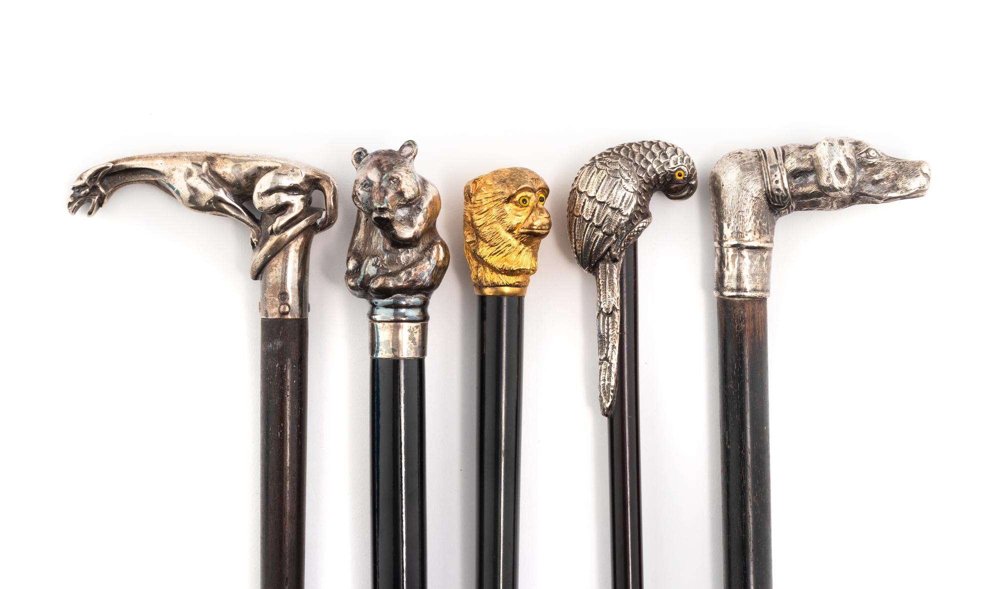 A Group of Five Silver Mounted Zoomorphic Form Walking Sticks