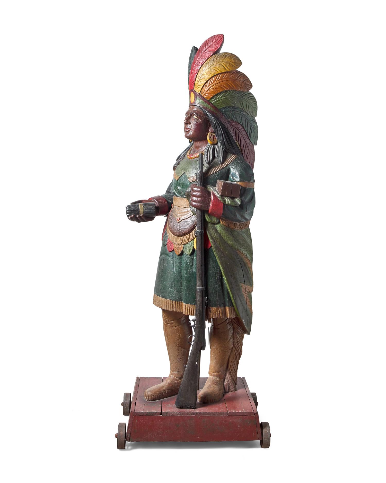 A Carved and Polychrome Painted Tobacconist Figure