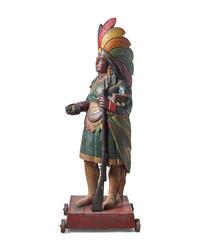 A Carved and Polychrome Painted Tobacconist Figure