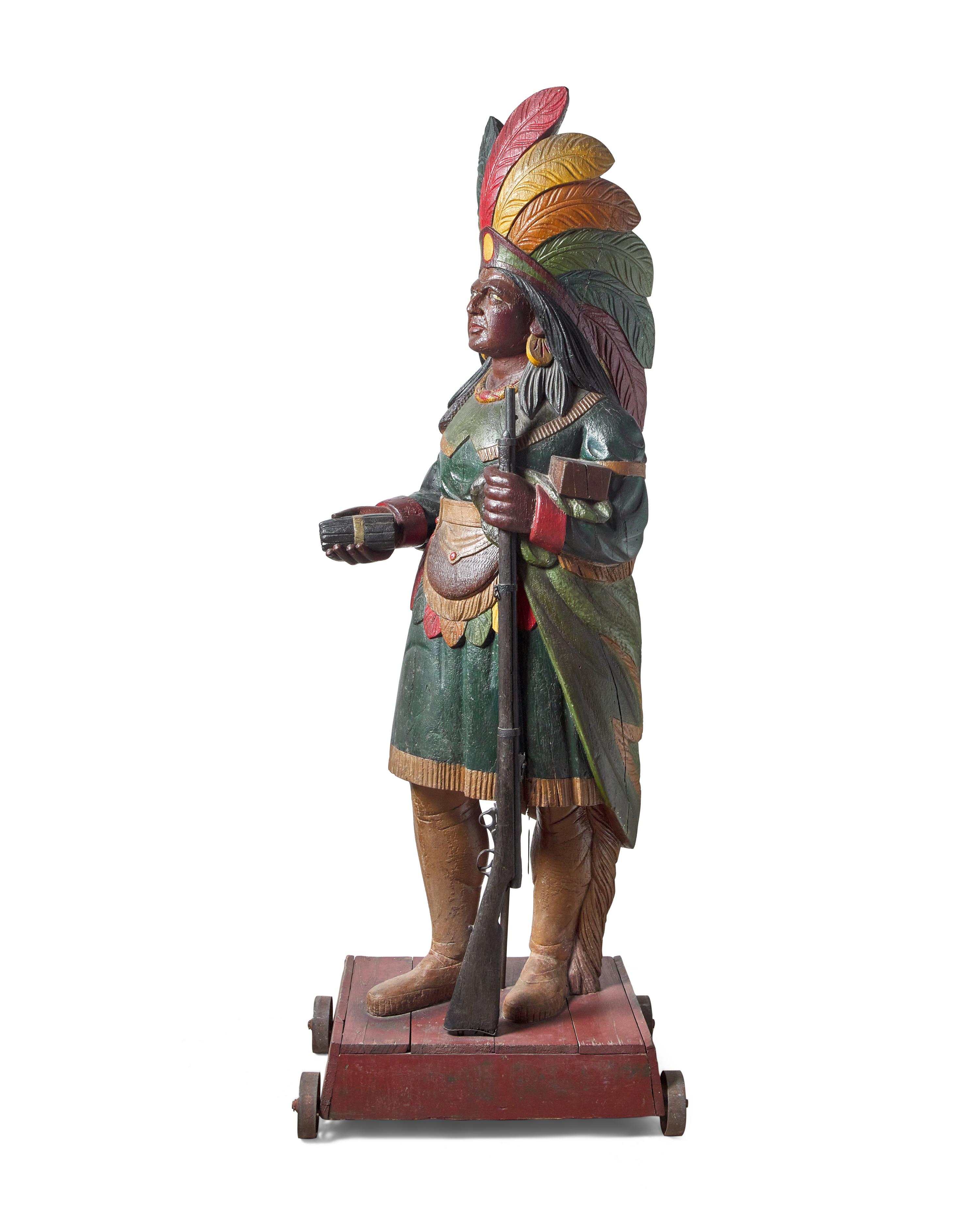 A Carved and Polychrome Painted Tobacconist Figure