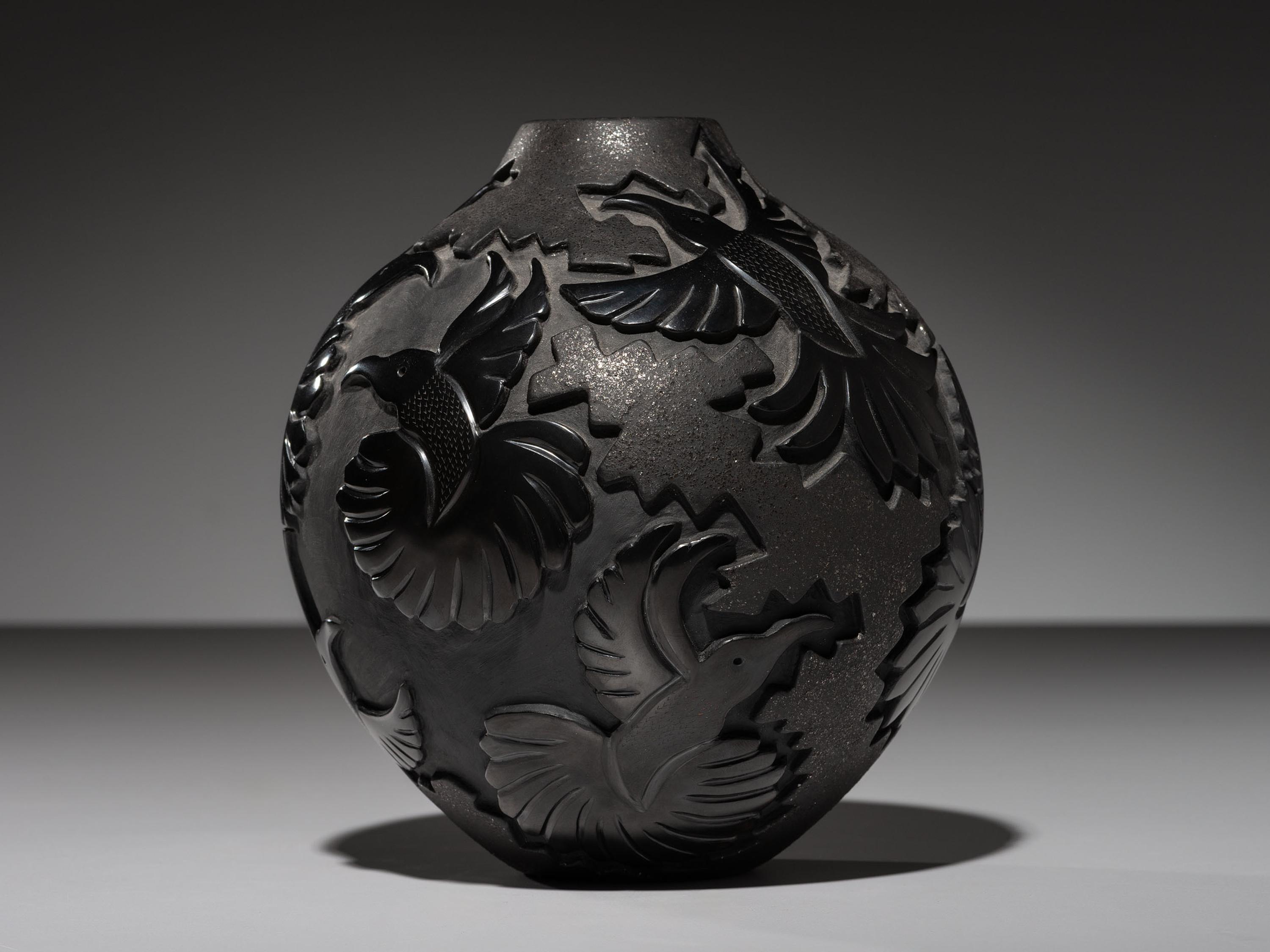 Carved Micaceous Blackware Jar, with Hummingbirds