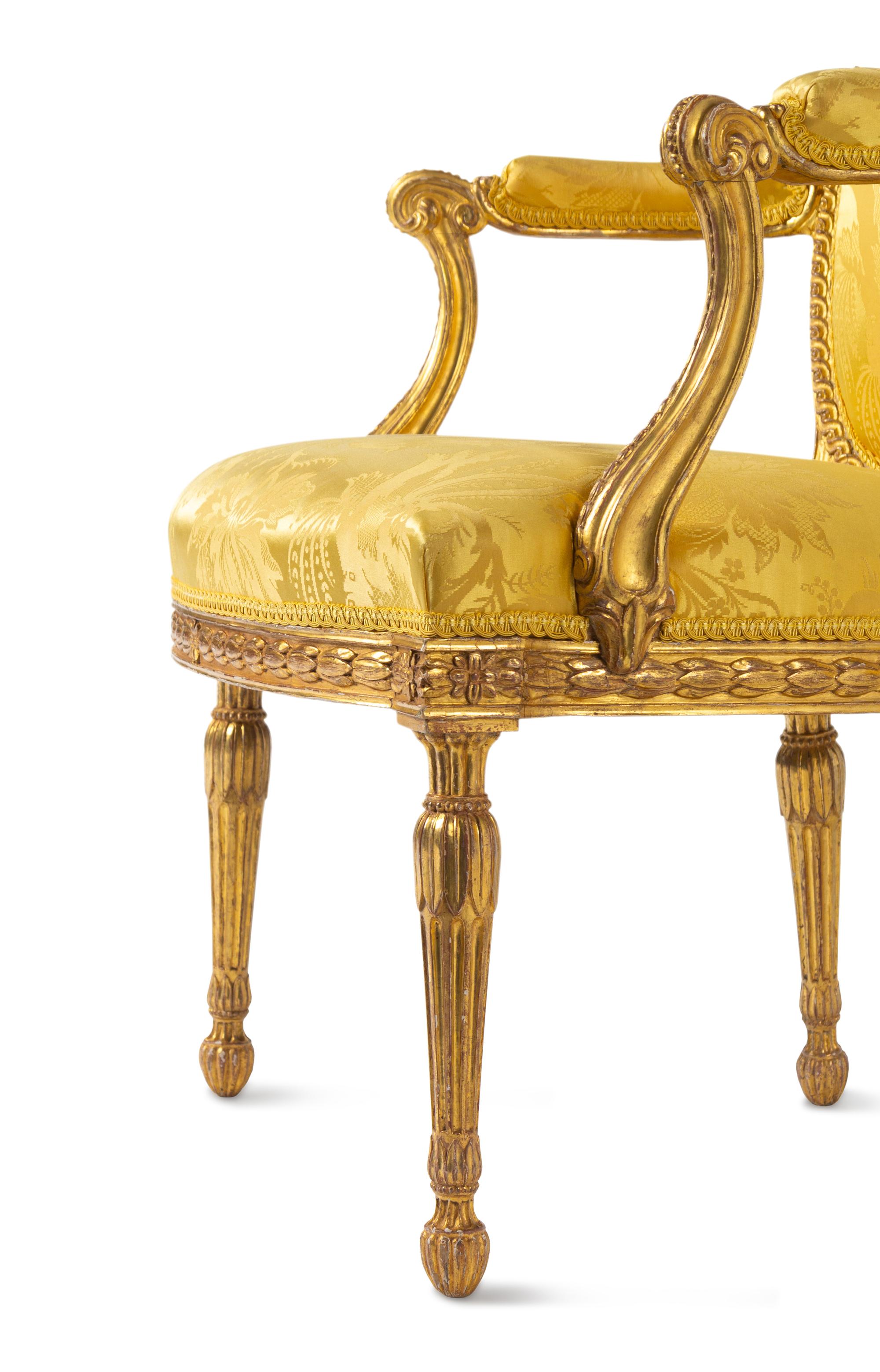 A Pair of George III Carved Giltwood Armchairs