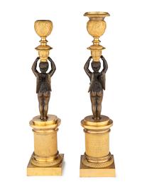A Pair of Restauration Ormolu and Patinated Bronze Figural Candlesticks