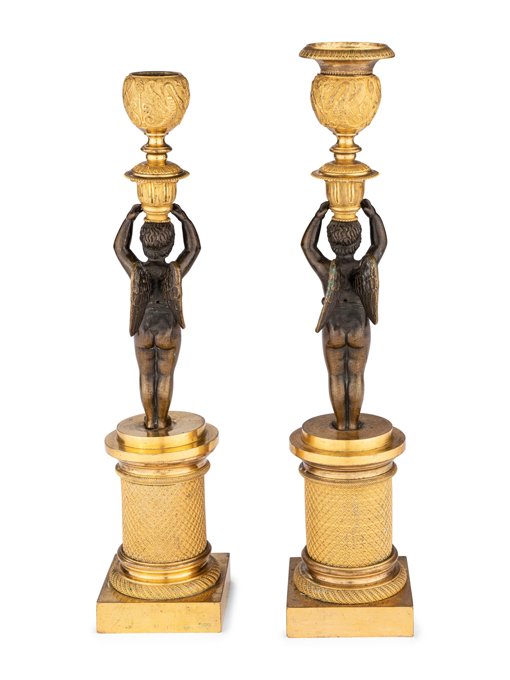A Pair of Restauration Ormolu and Patinated Bronze Figural Candlesticks