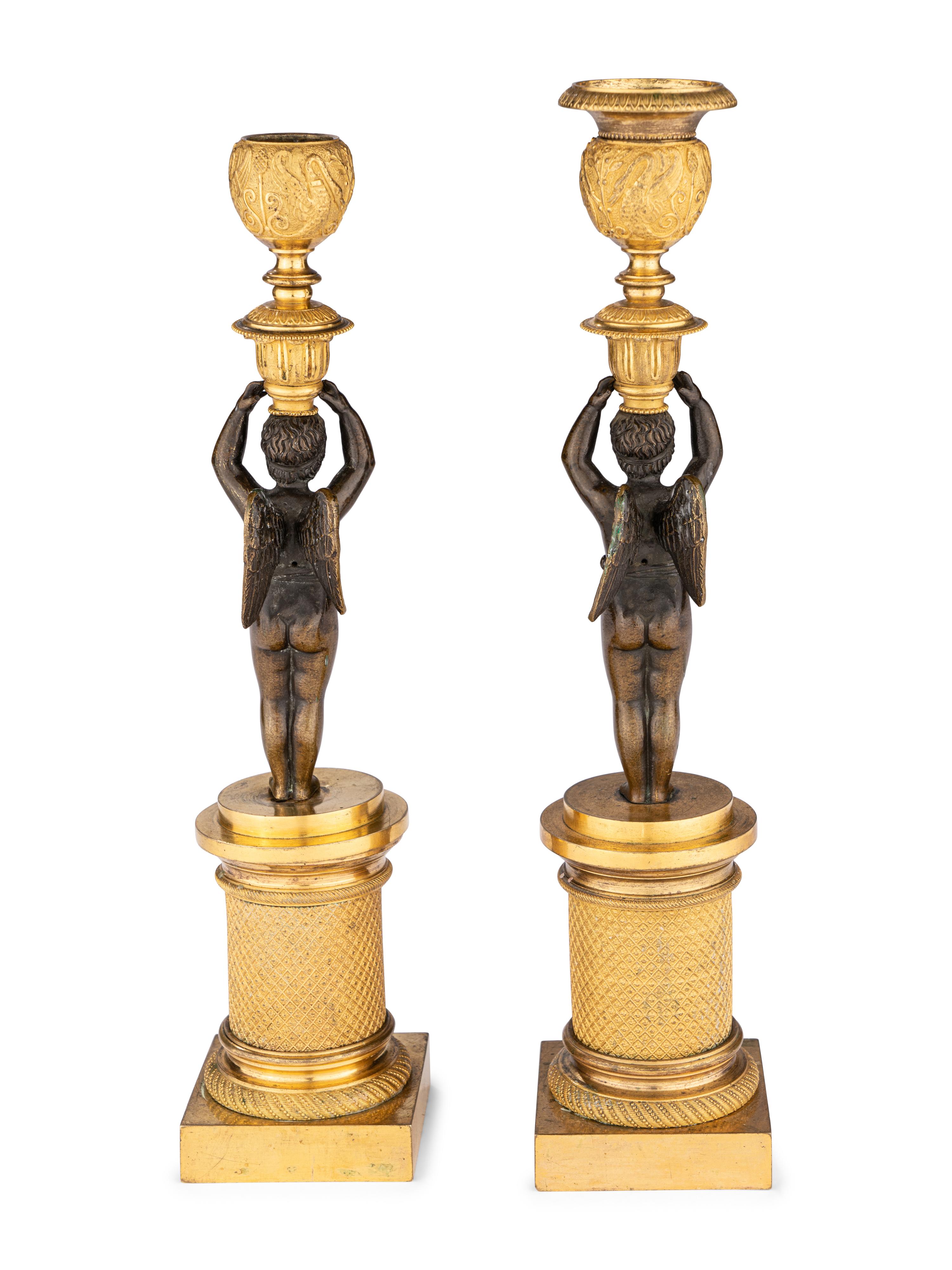 A Pair of Restauration Ormolu and Patinated Bronze Figural Candlesticks
