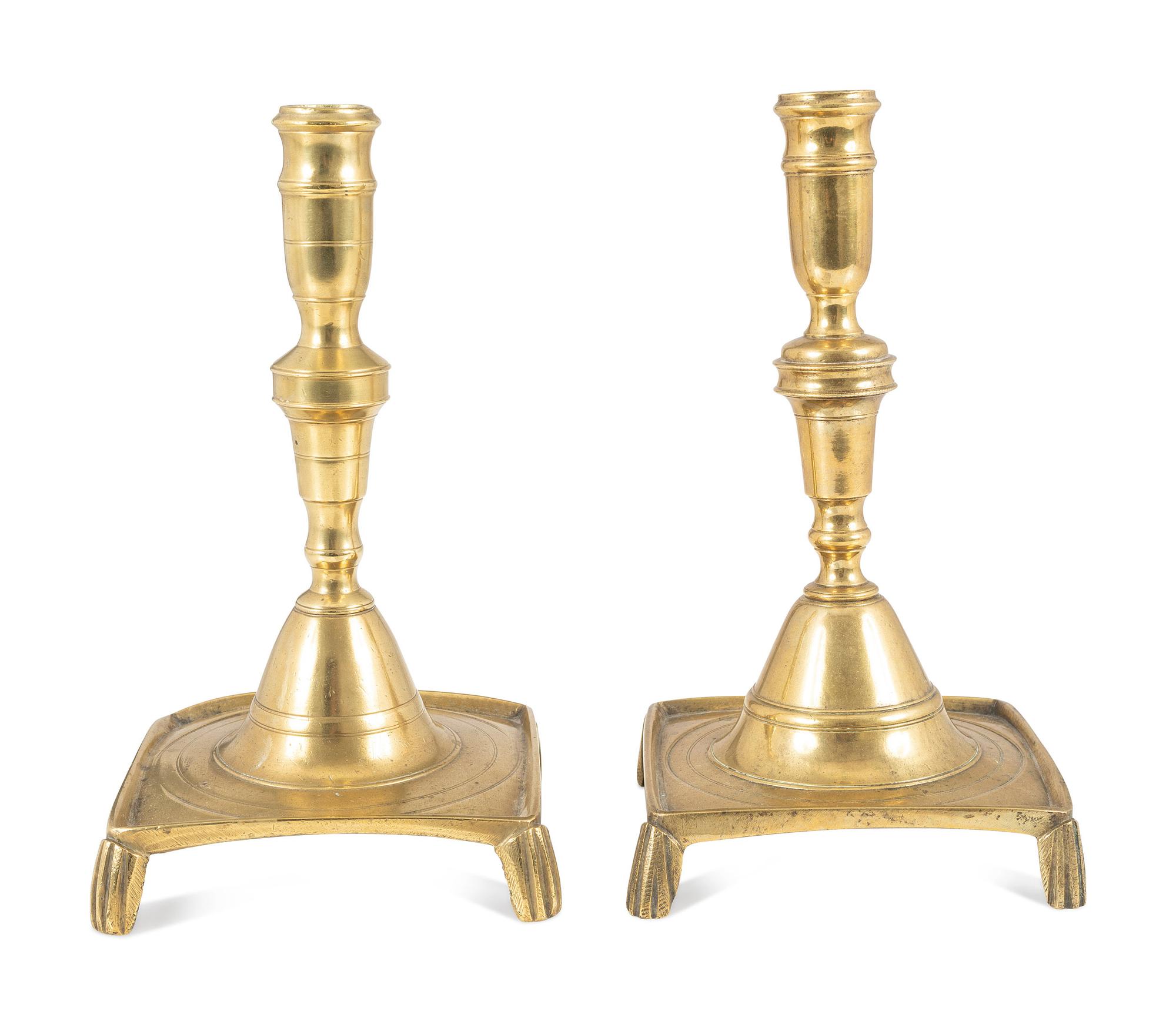 A Matched Pair of Continental Brass Footed and Dished Square Base Candlesticks