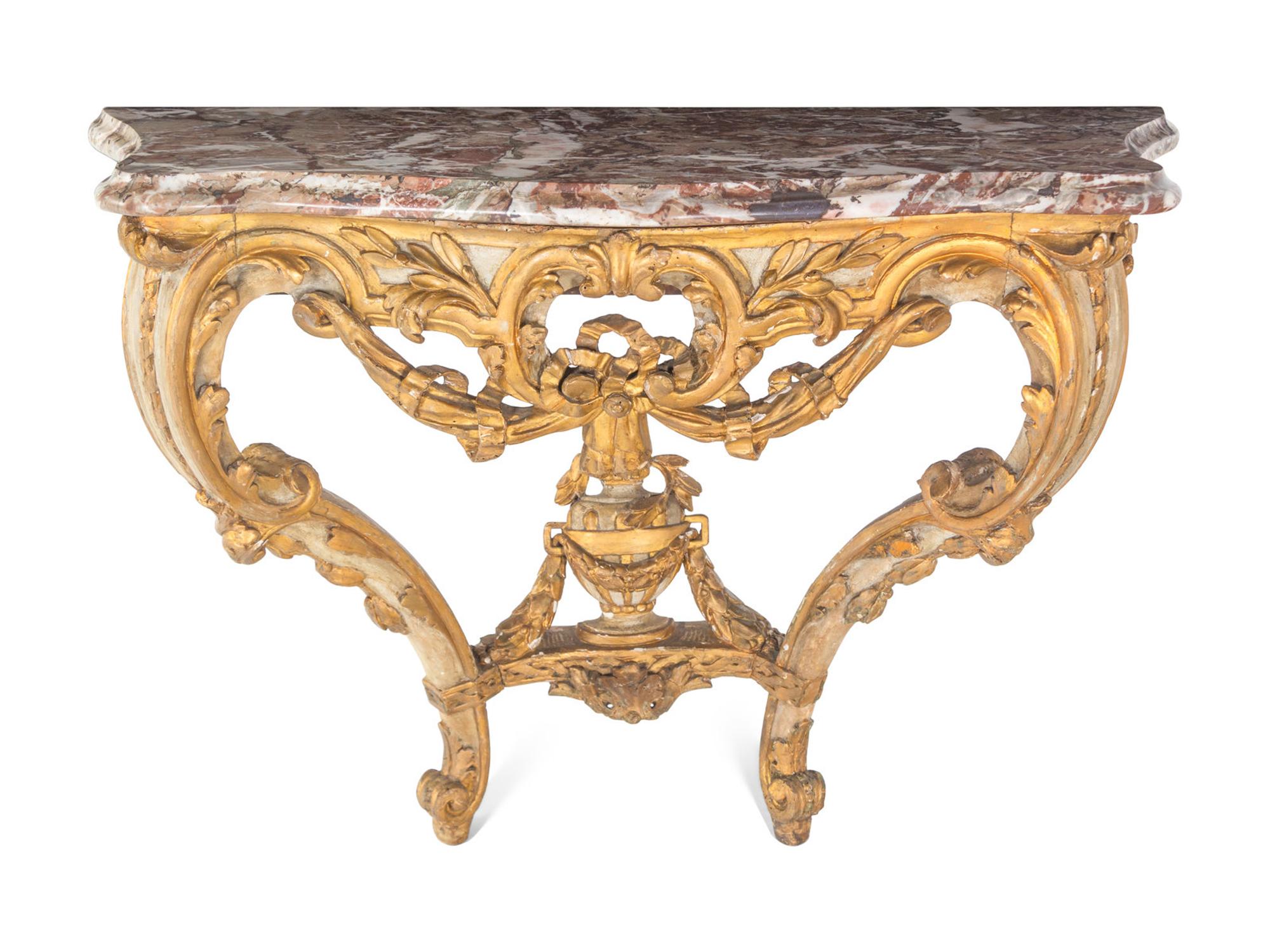 An Italian Rococo Parcel-Gilt and White-Painted Carved Wood Marble-Top Console Table