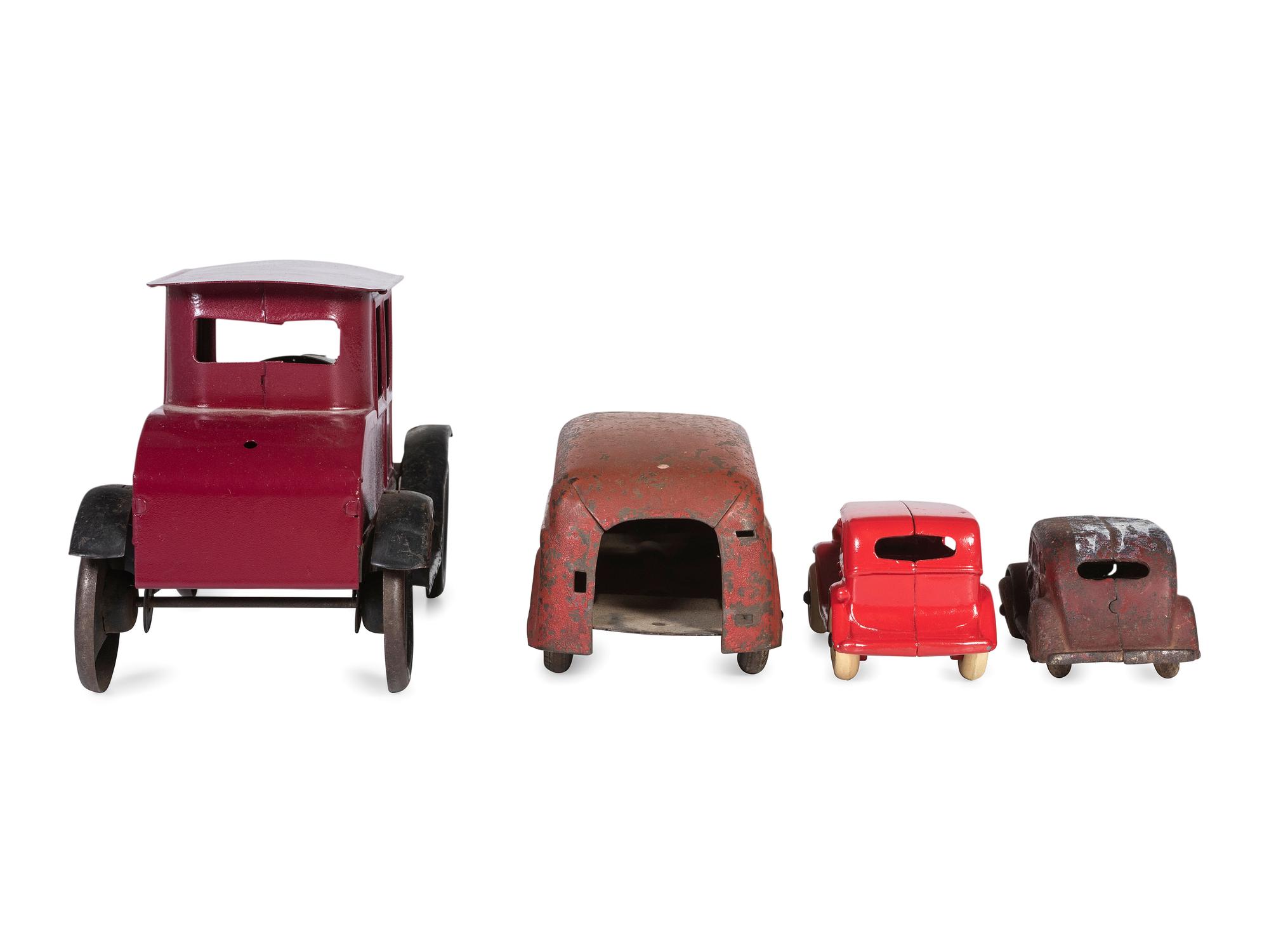 A Group of Toy Service Stations and Cars