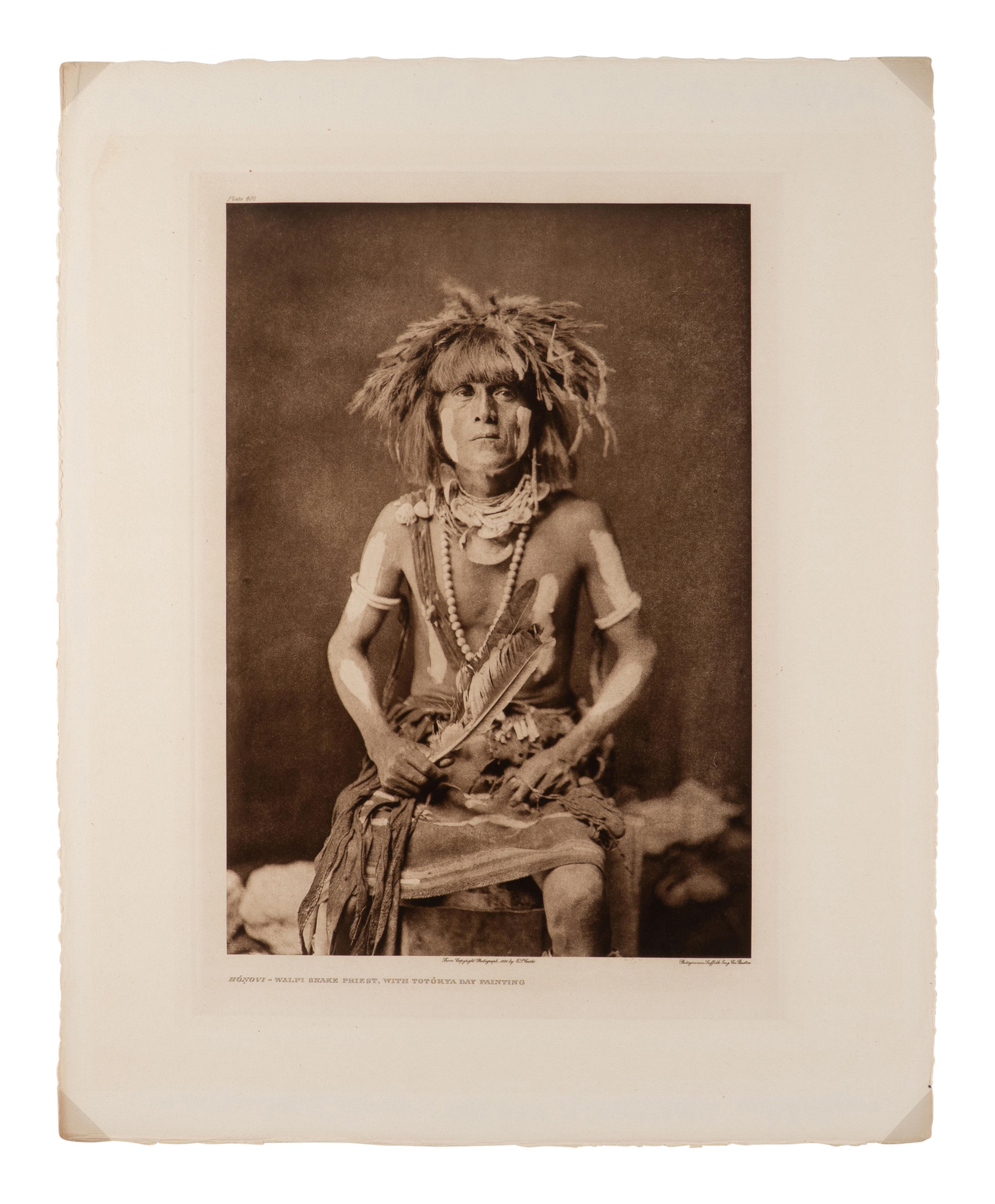 CURTIS, Edward (1868-1952), photographer. Hónovi - Walpi Snake Priest, with Totókya Day Painting . Portfolio photogravure.
