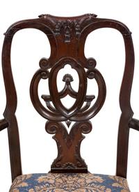 A Set of Twelve Continental Walnut Dining Chairs