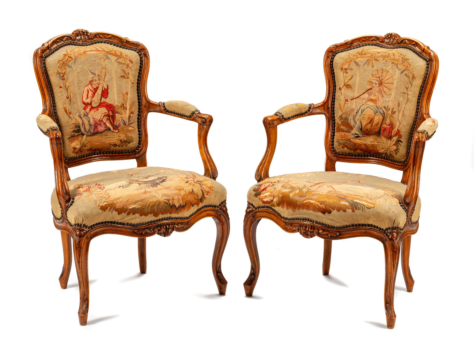 A Pair of Louis XV Tapestry-Upholstered Walnut Fauteuils
