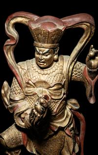A Set of Four Gilt and Red Lacquered Wood Figures of Guardians