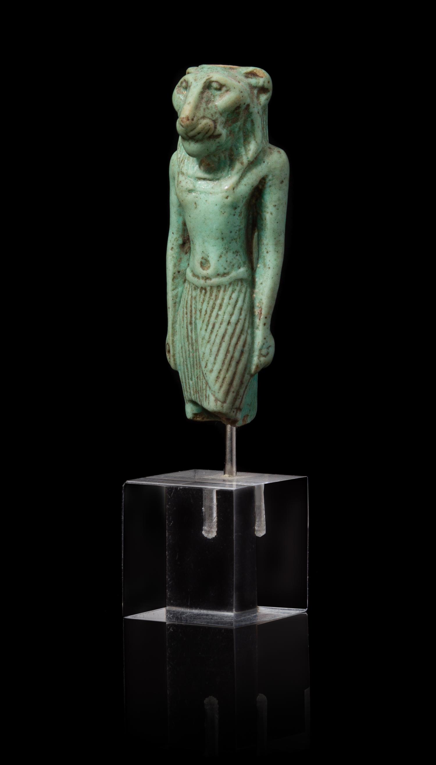 An Egyptian Faience Amulet of Mahes Height 2 1/4 inches. — LATE PERIOD TO PTOLEMAIC PERIOD, 664-30 B.C.E.