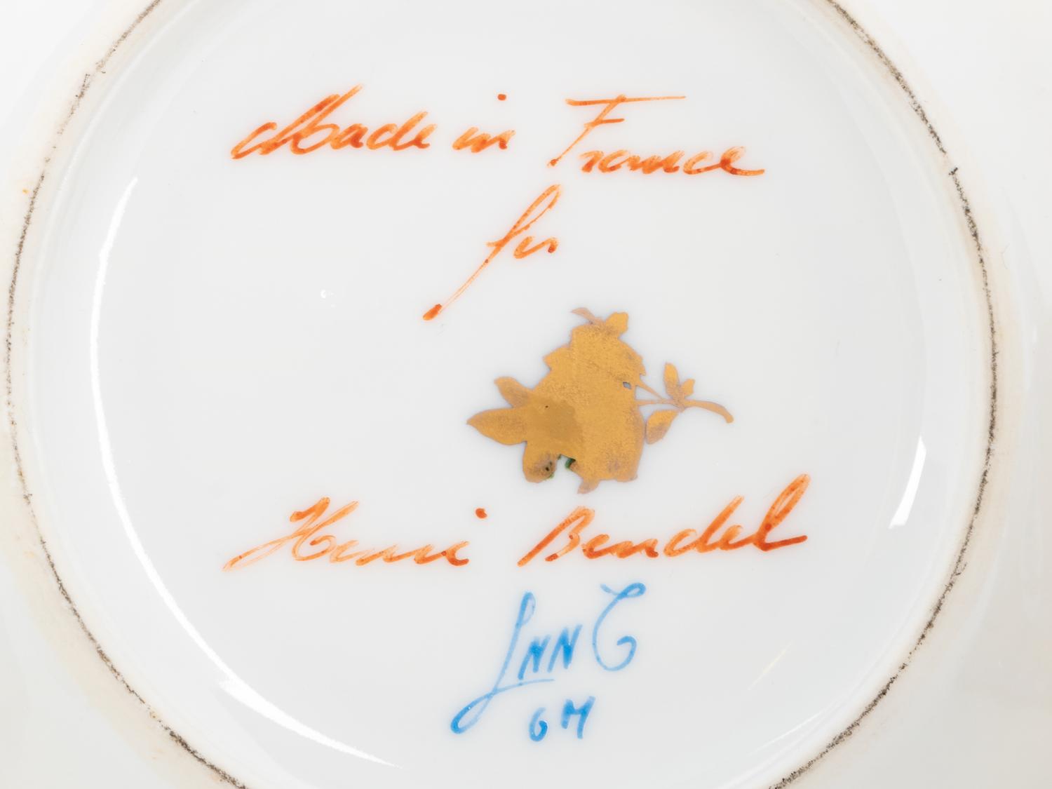 A Group of French Painted Porcelain Coffee Cups and Saucers