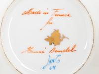 A Group of French Painted Porcelain Coffee Cups and Saucers