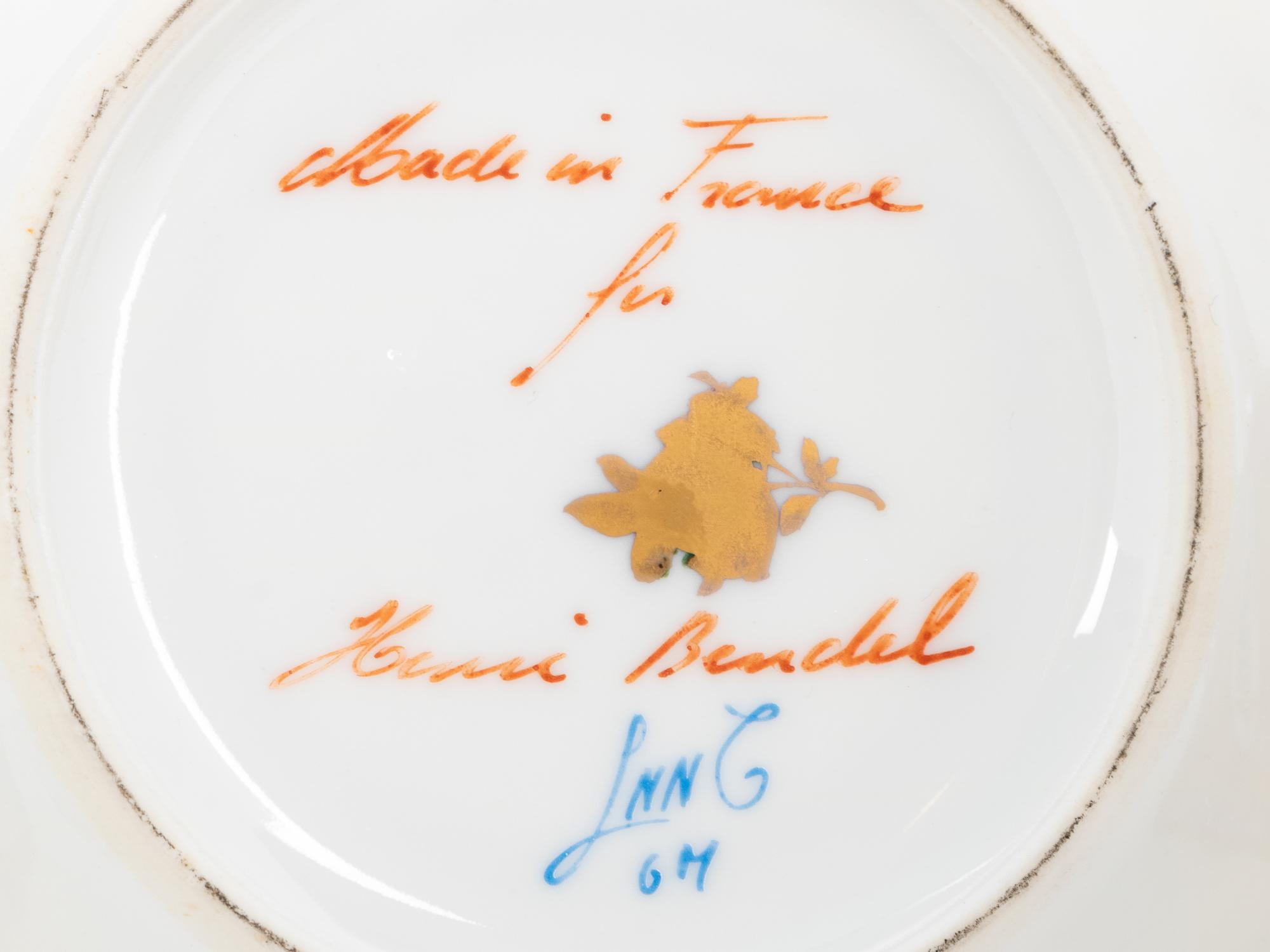 A Group of French Painted Porcelain Coffee Cups and Saucers
