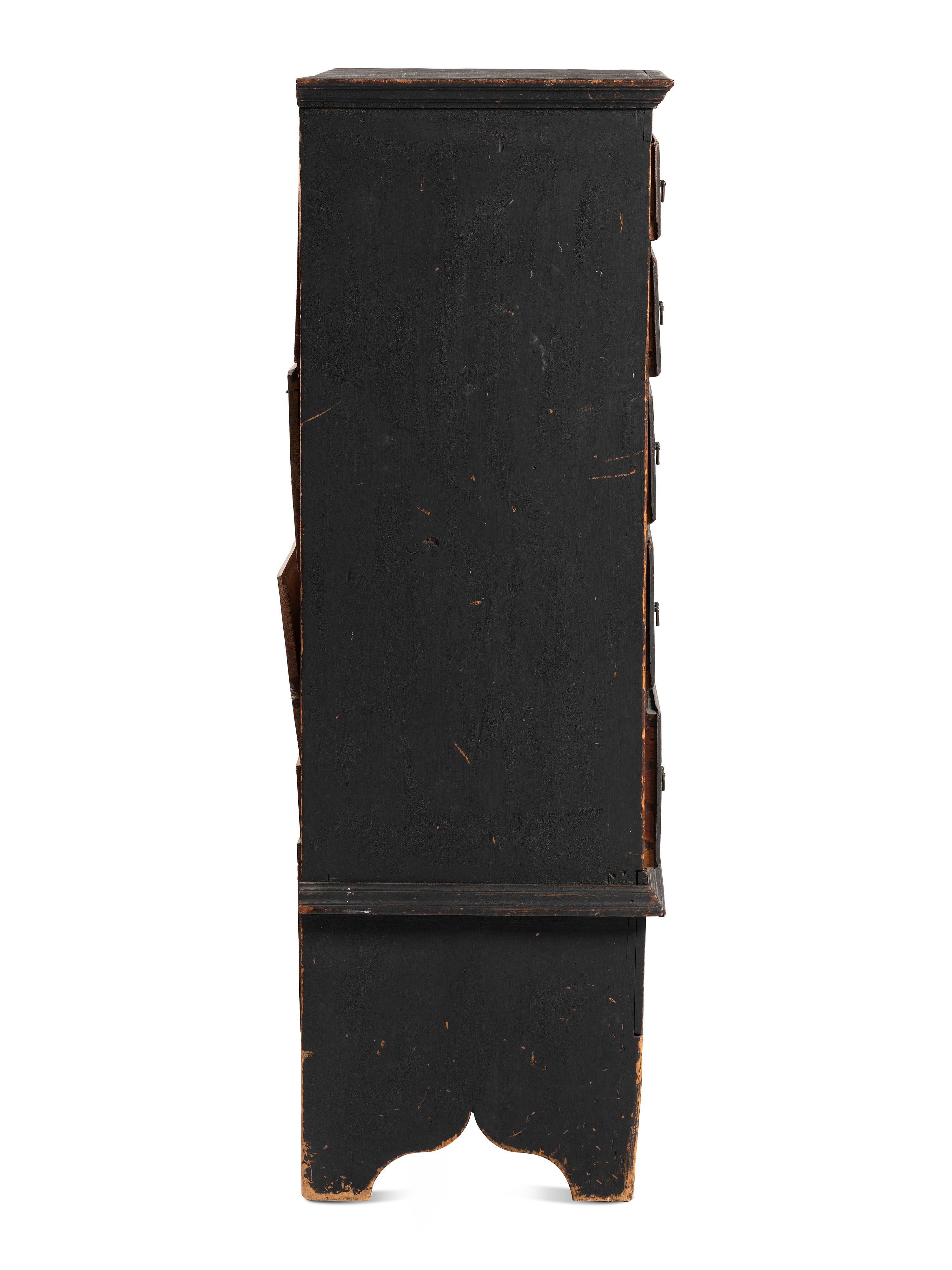 A Country Queen Anne Black Painted Cherrywood and Pine Tall Chest of Drawers, 18th Century