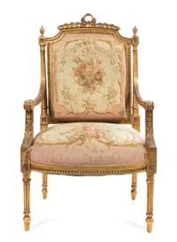 A Louis XVI Style Giltwood Fauteuil Height 40 inches. — 19TH CENTURY