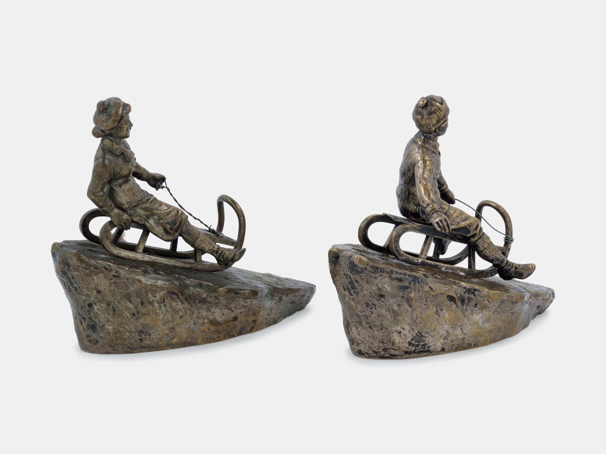 Two Figural Sculptures on Sleds Argentor, Vienna