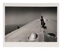 EISENSTAEDT, Alfred (1898-1995). A photograph of workers repairing the hull of the Graf Zeppelin.