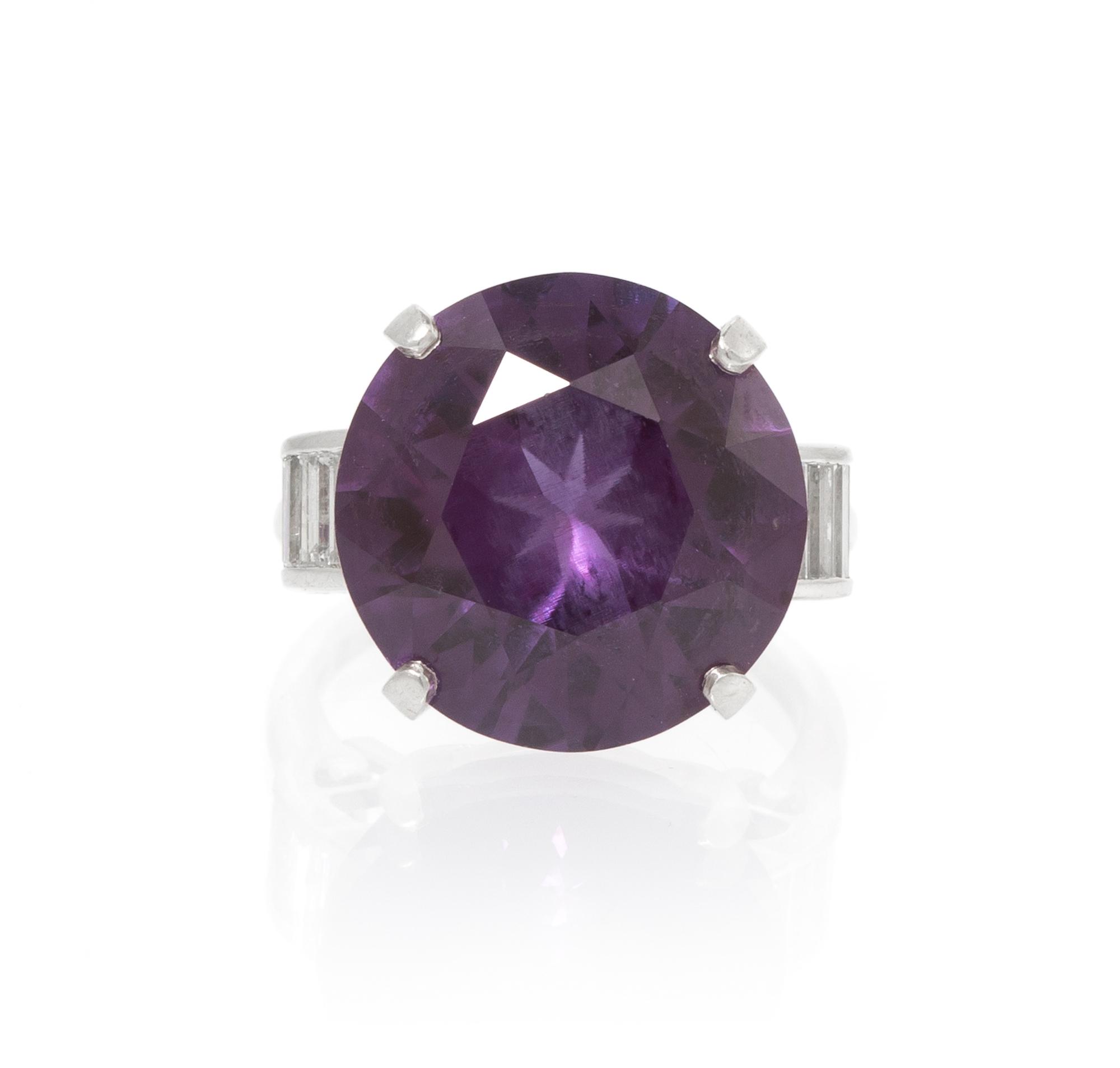 A Platinum, Synthetic Color Change Sapphire and Diamond Ring, 6.80 dwts.