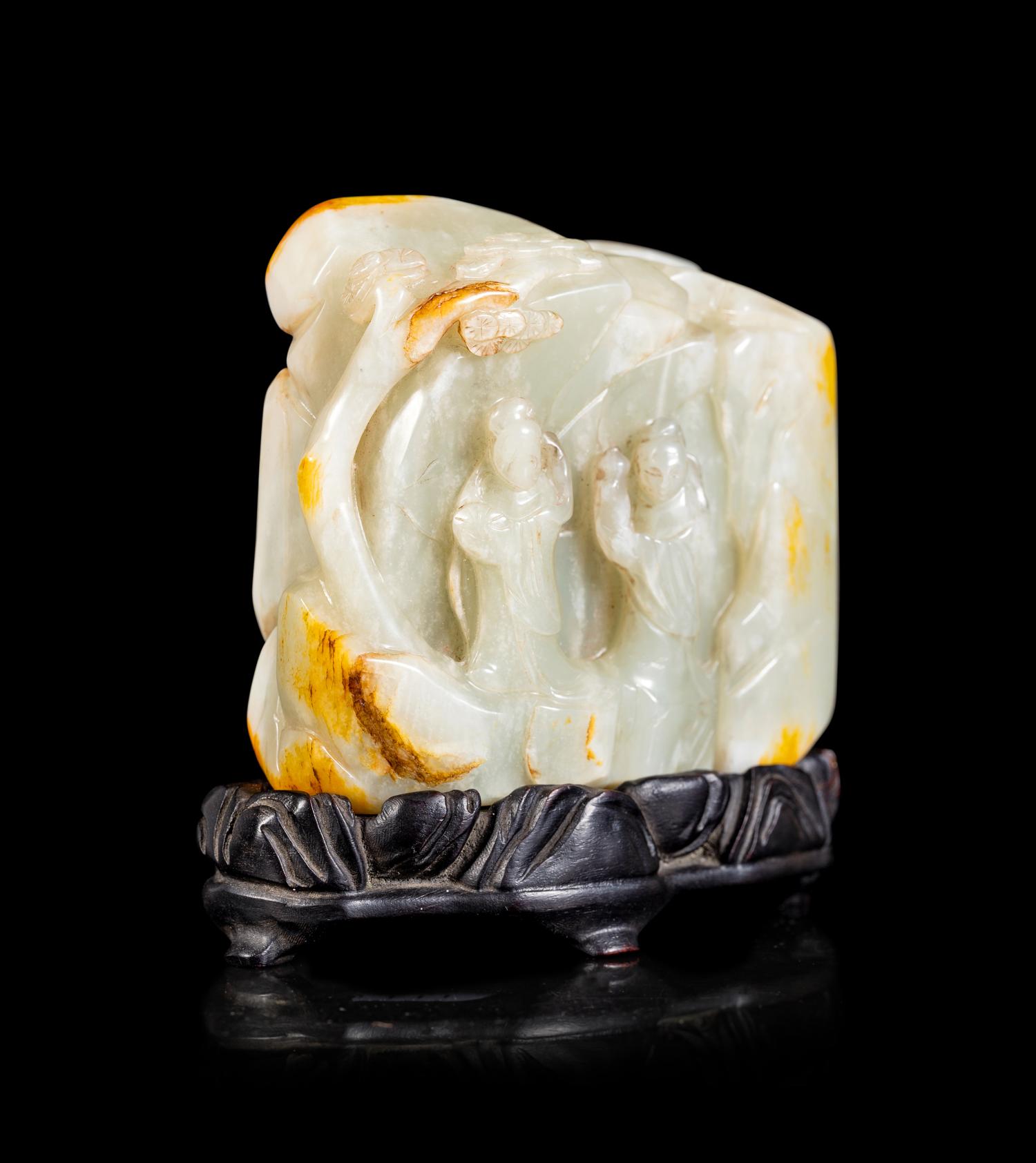A Chinese Celadon and Russet Jade Boulder