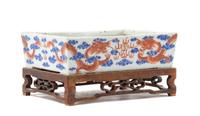 A Blue and Iron Red Porcelain Cachepot Length 7 1/2 inches.