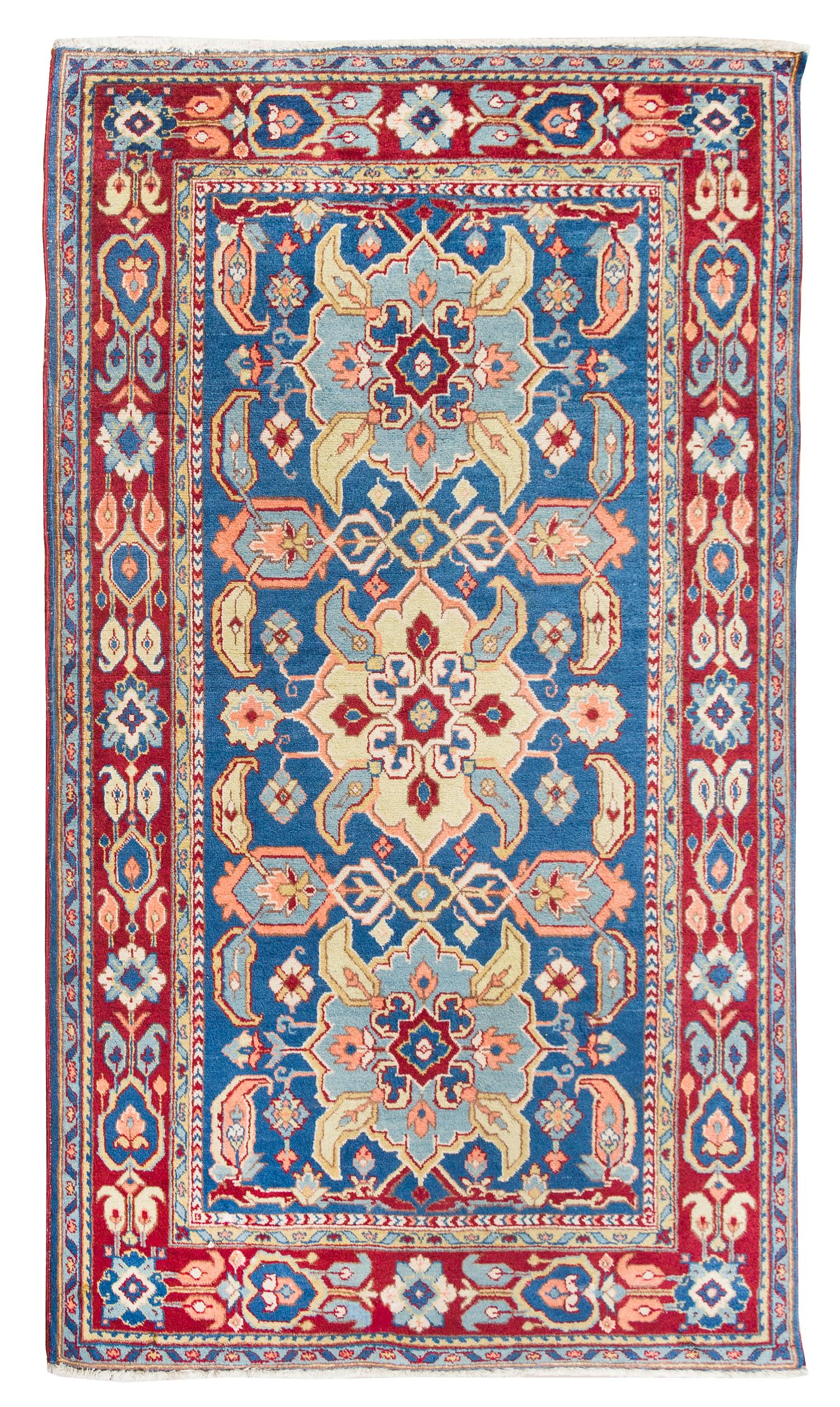 A Persian Wool Rug 5 feet 10 inches x 3 feet 5 inches.