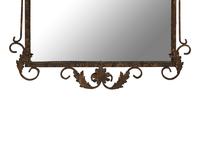 A Whimsical Patinated and Parcel Gilt Metal Framed Mirror