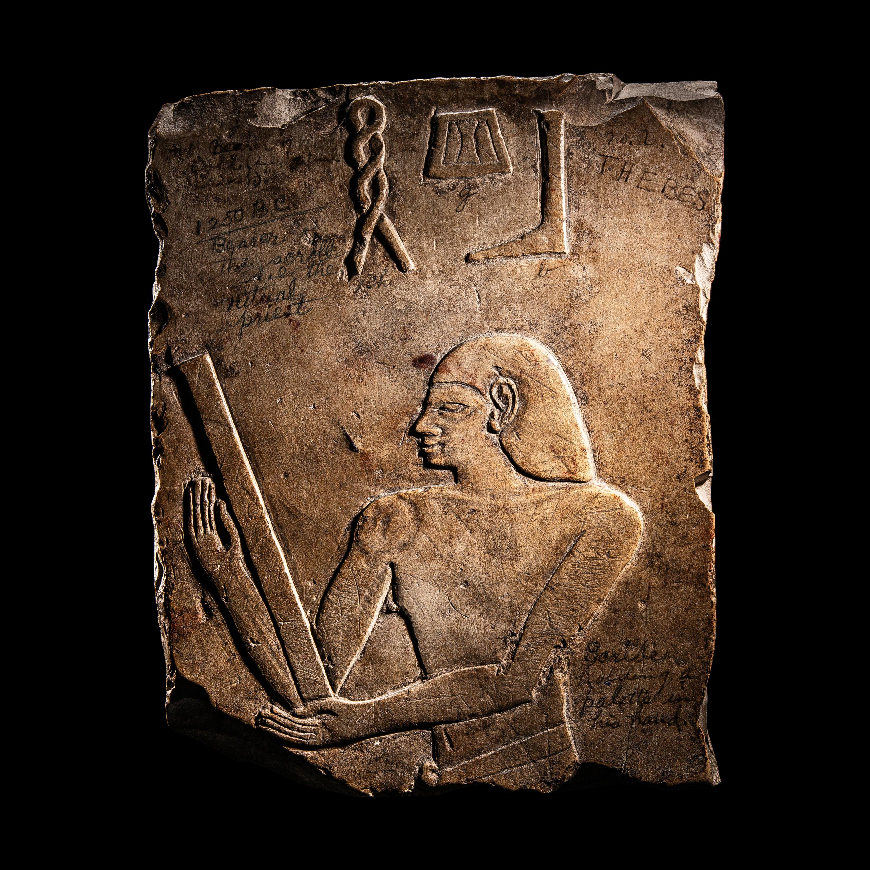 An Egyptian Limestone Relief Fragment with a Priest