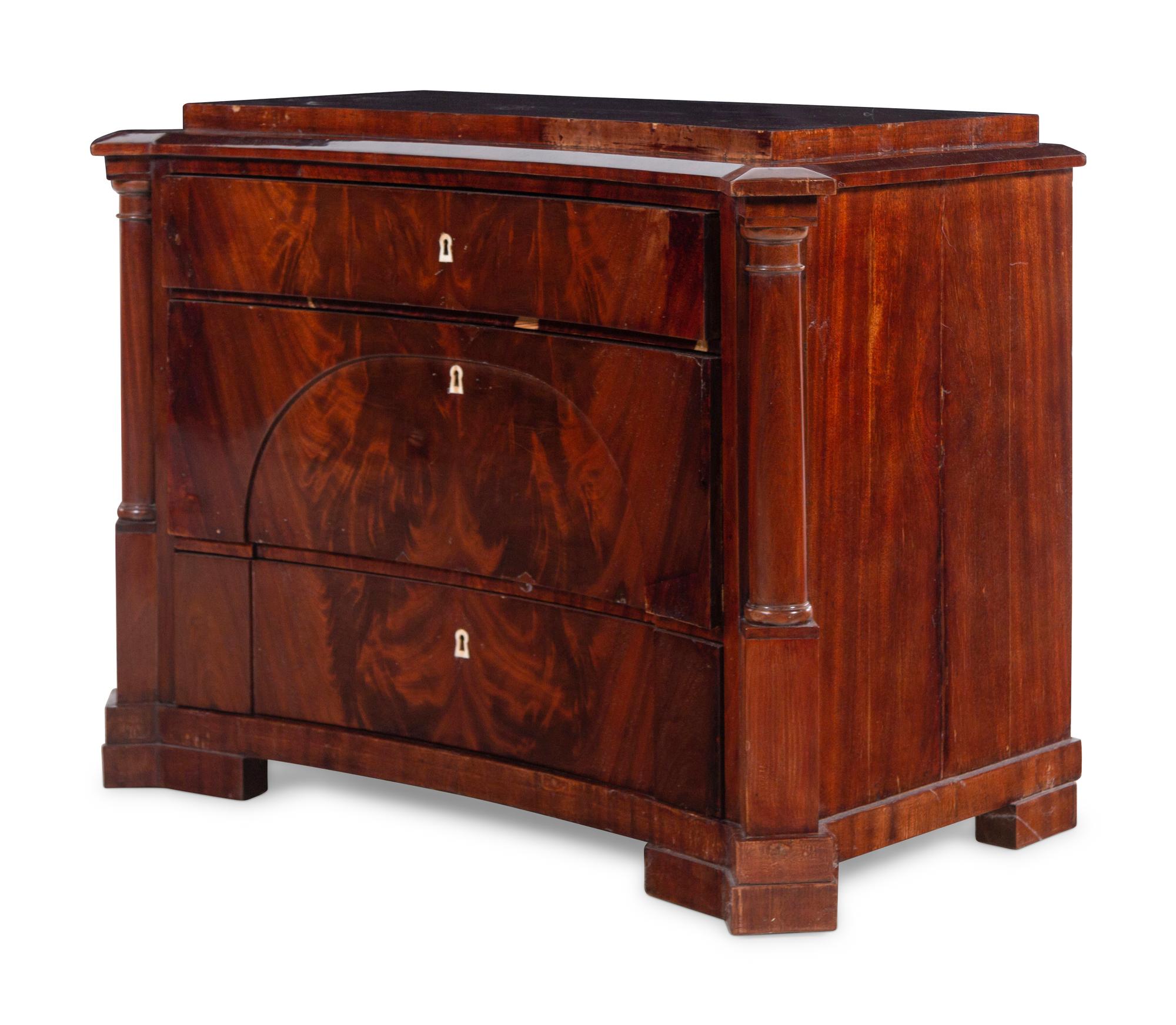 A German Mahogany Concave-Front Chest of Drawers