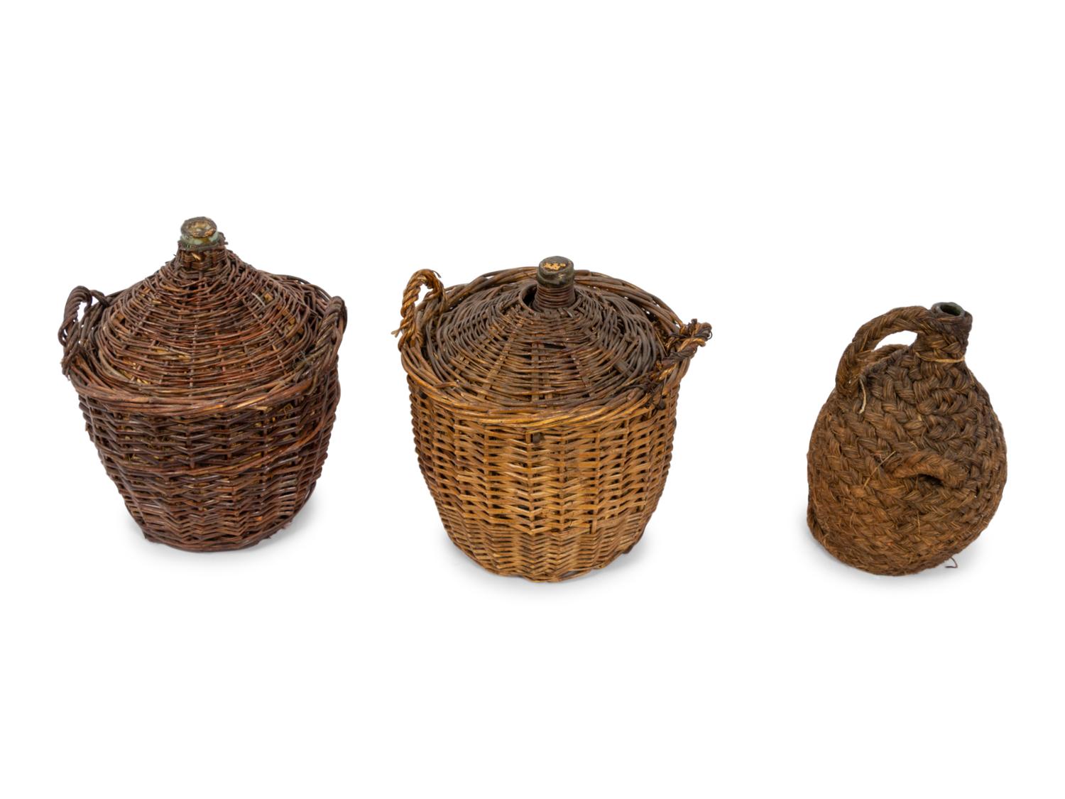 A Group of Seven Continental Rattan and Glass Wine Jugs
