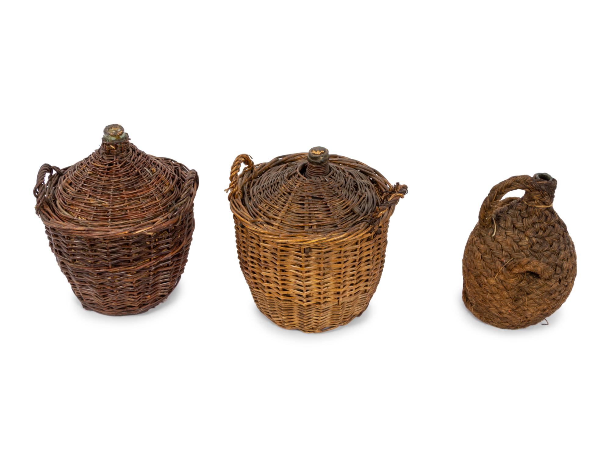 A Group of Seven Continental Rattan and Glass Wine Jugs
