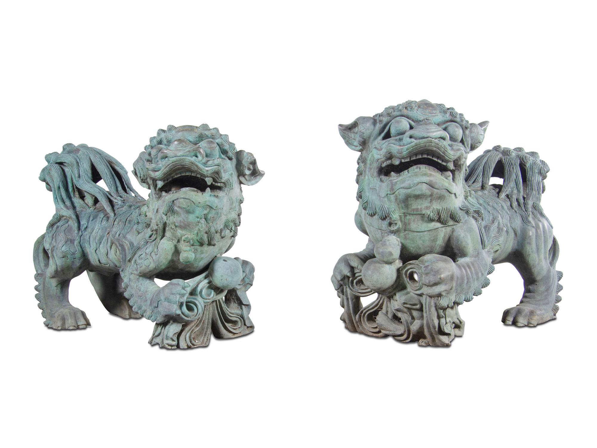 A Pair of Patinated Bronze Buddhistic Lions