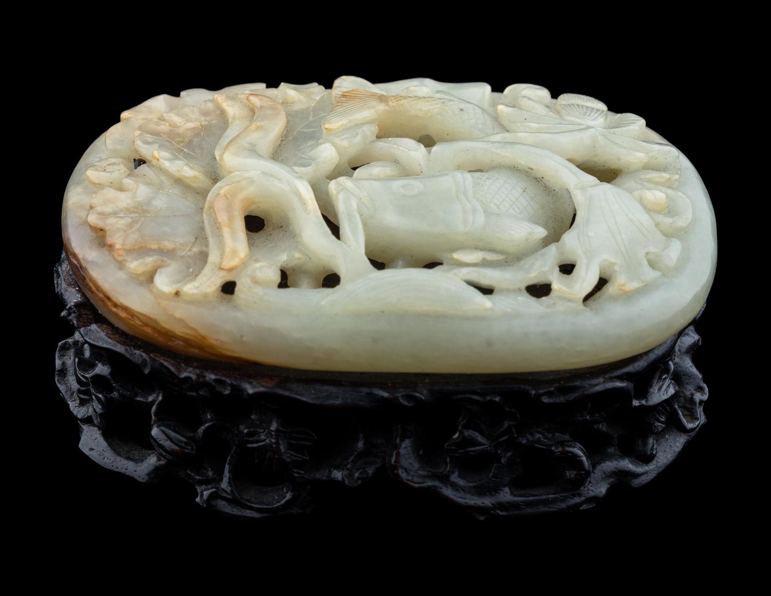 A Carved Celadon Jade 'Carp and Lotus' Plaque