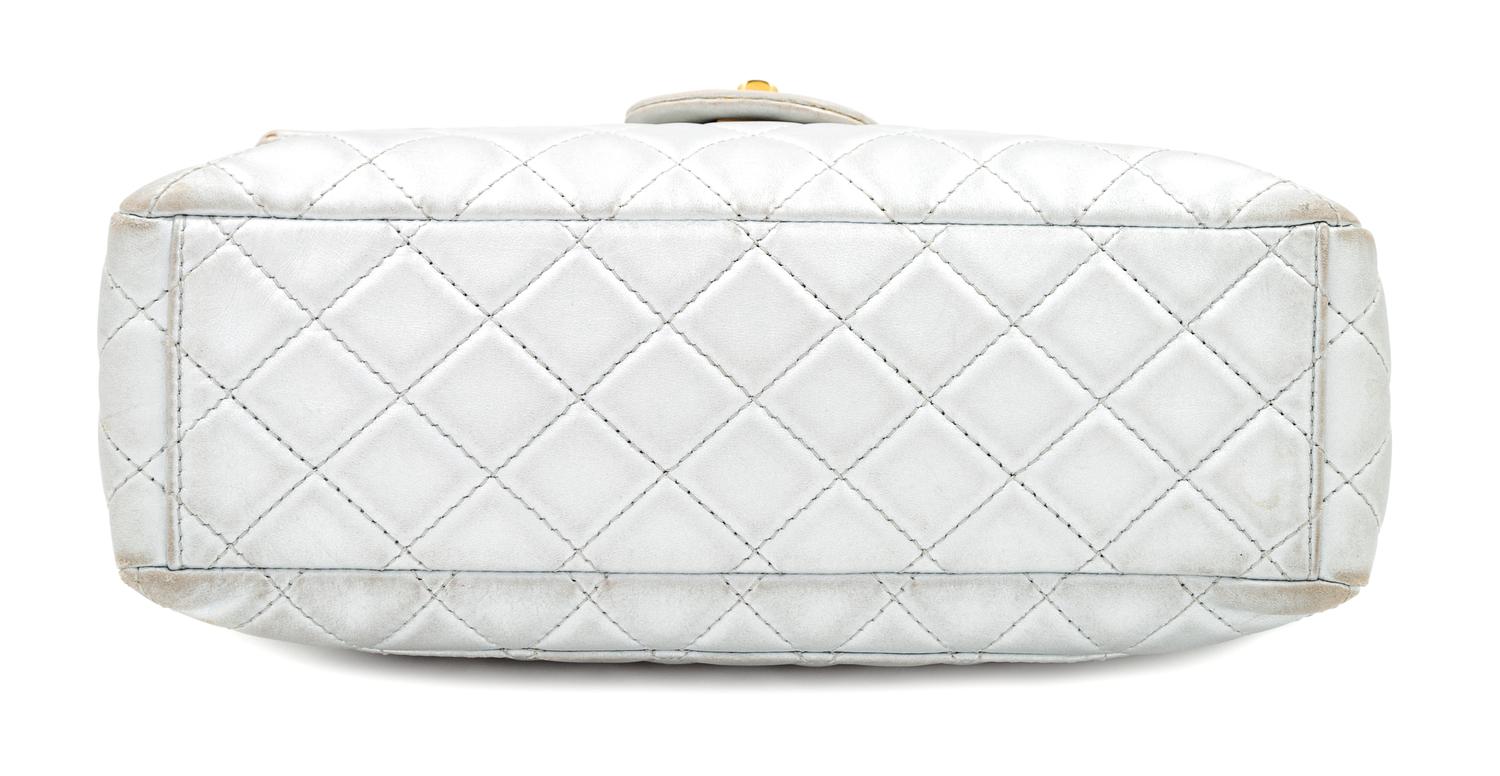 A Chanel Silver Leather Jumbo Flap Bag, 8" H x 13" W x 4" D; Strap drop: 11.5" - 20".