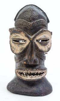 A Group of Four Masks Height of largest 14 1/2 inches.