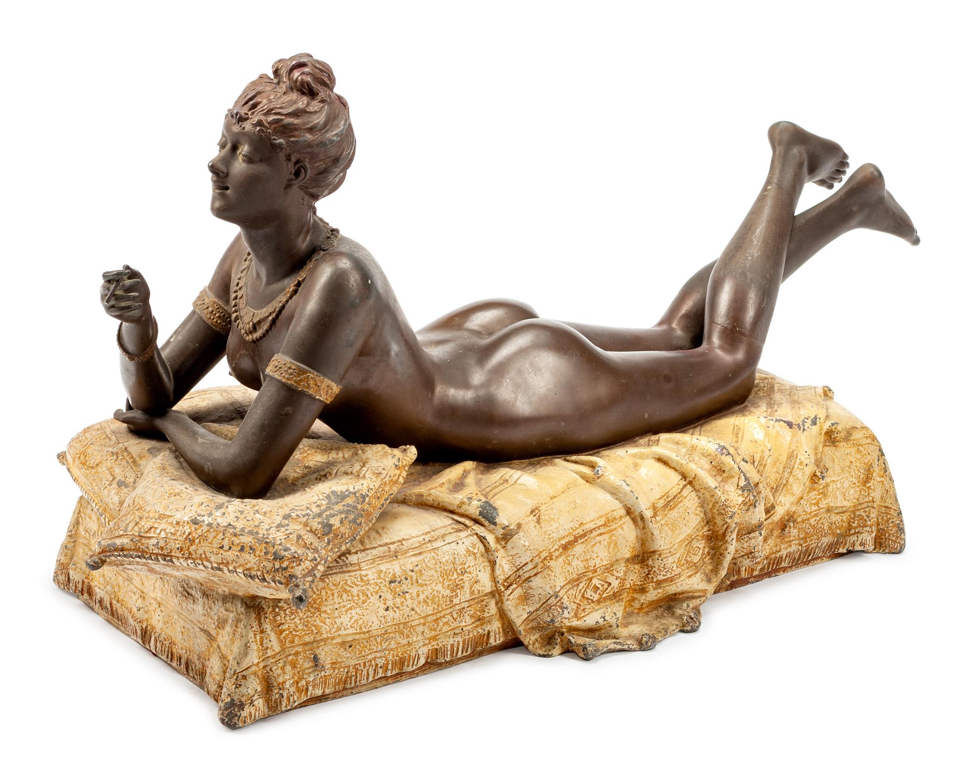 A Large Cold-Painted Metal Erotic Figure of a Reclining Woman