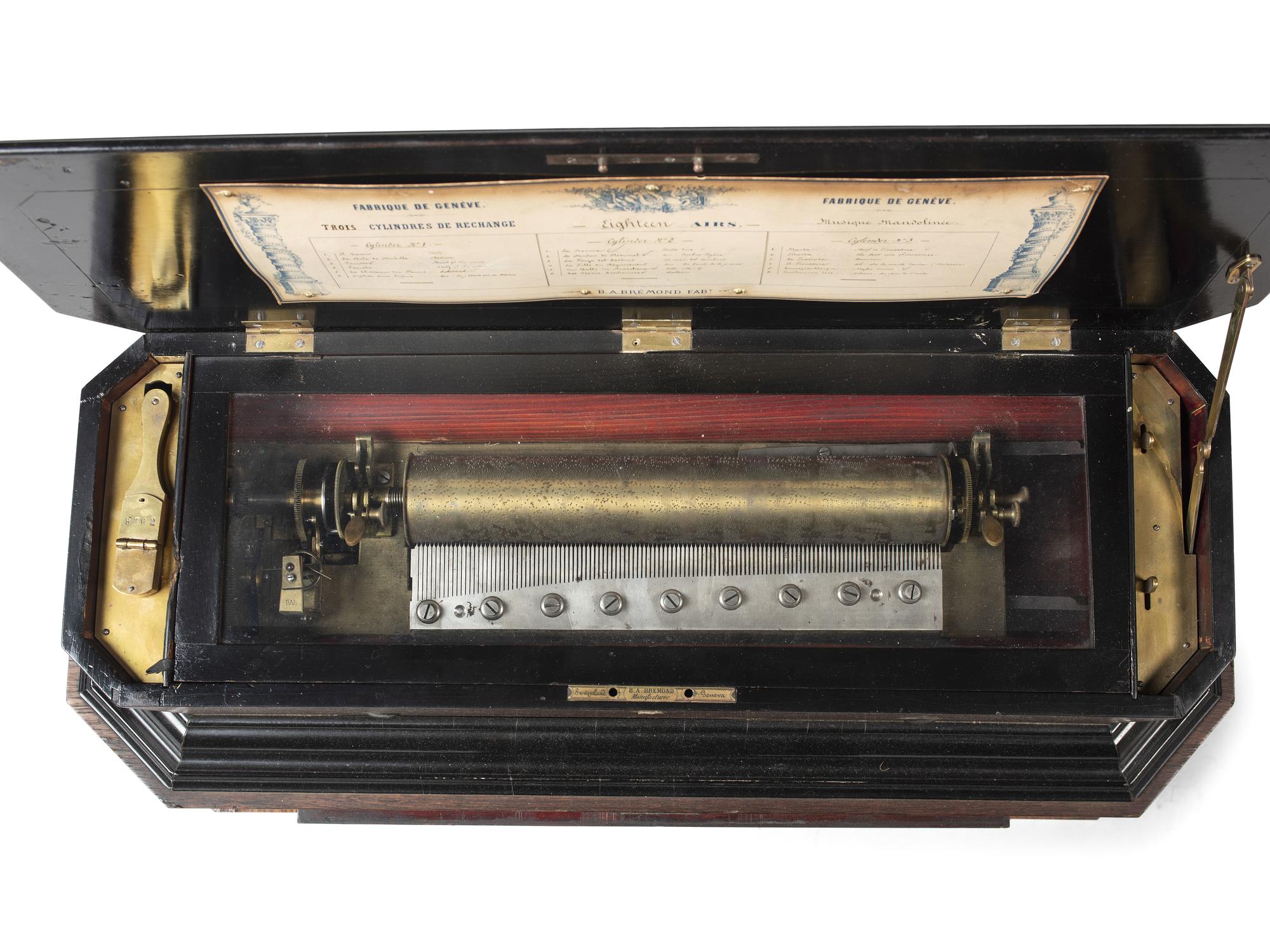 A Swiss Inlaid Mahogany Three-Cylinder Music Box