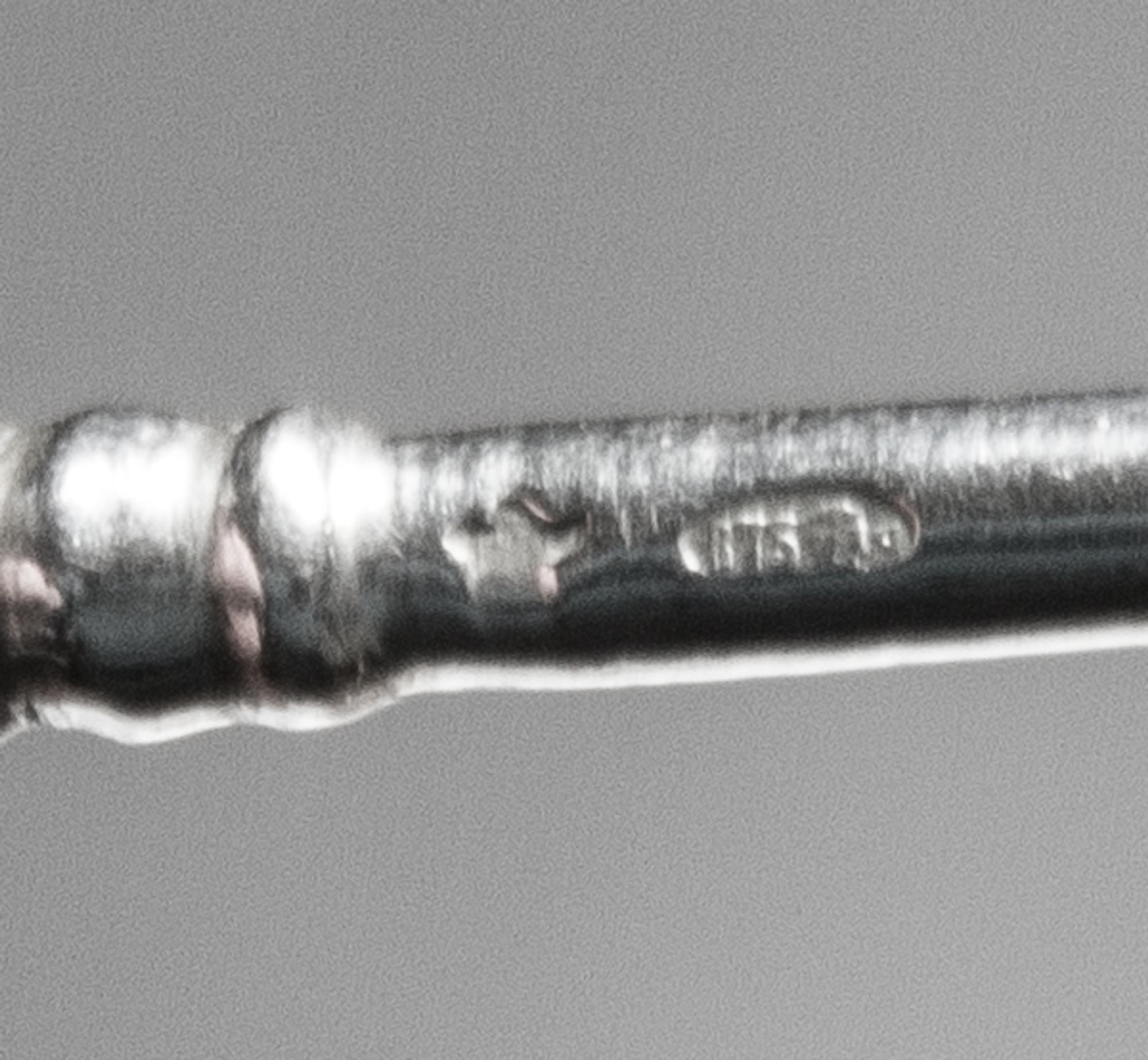 A Set of Six Russian Niello Silver Teaspoons, Maker's marks obscured, Moscow, late 19th/early 20th century, each having a knopped stem,