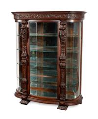 A Renaissance Revival Carved Oak Vitrine