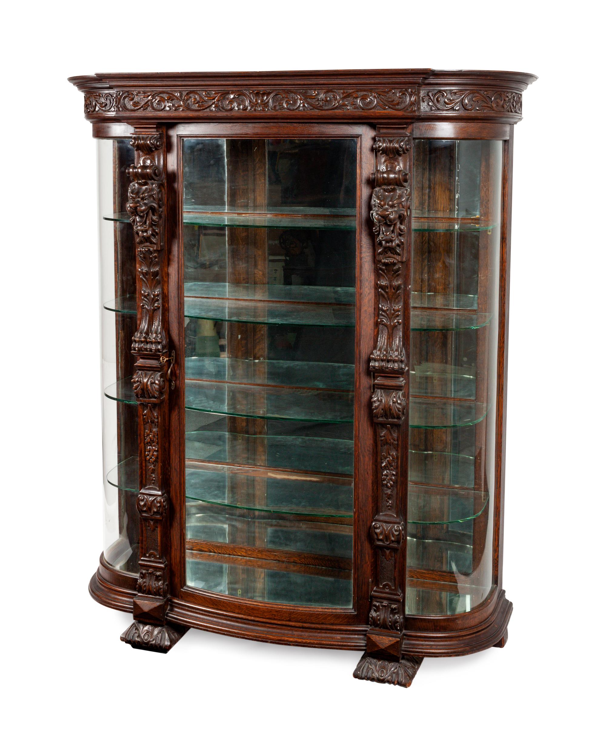 A Renaissance Revival Carved Oak Vitrine
