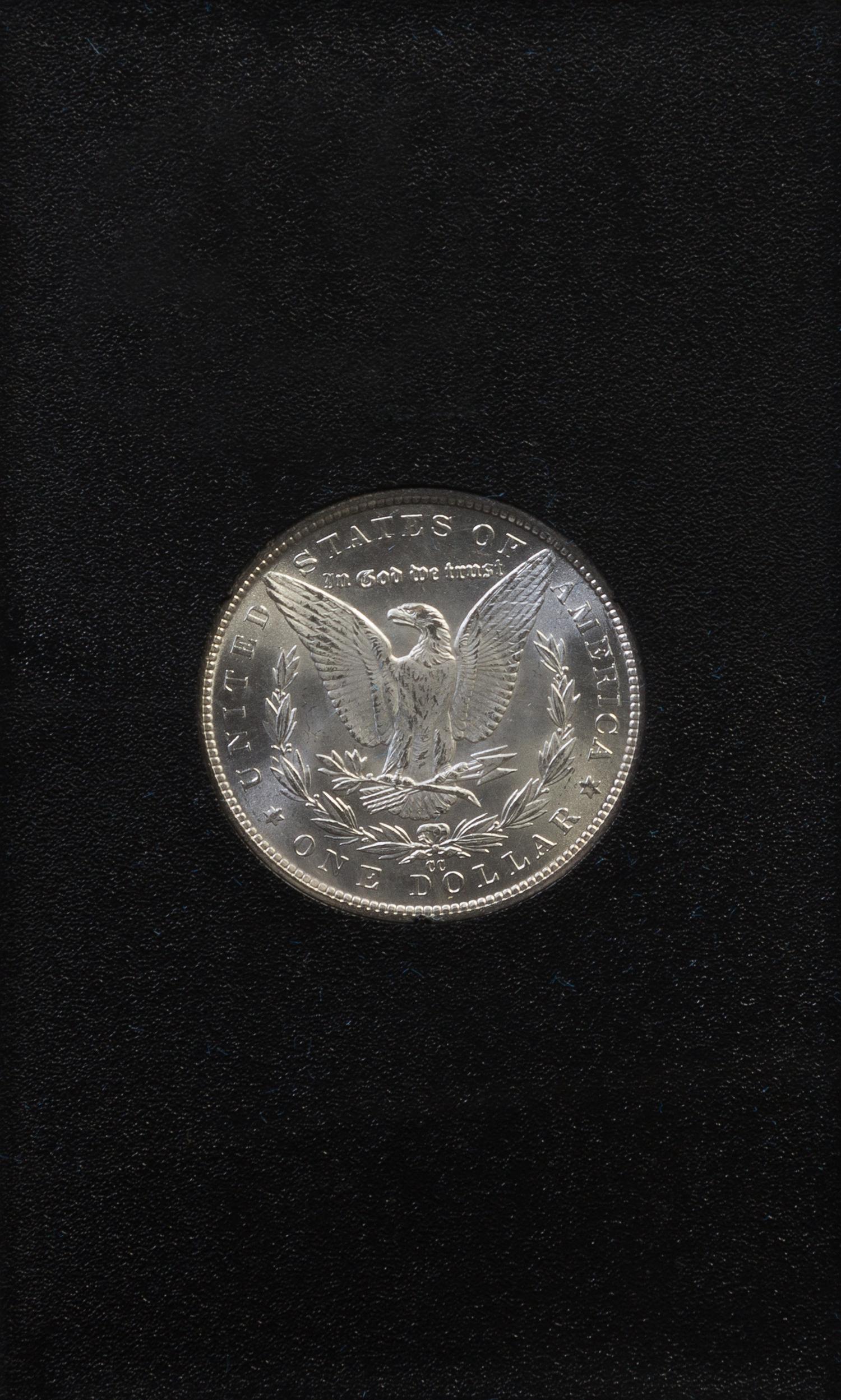 A Group of Four United States 1884-CC GSA Uncirculated Morgan Silver Dollars