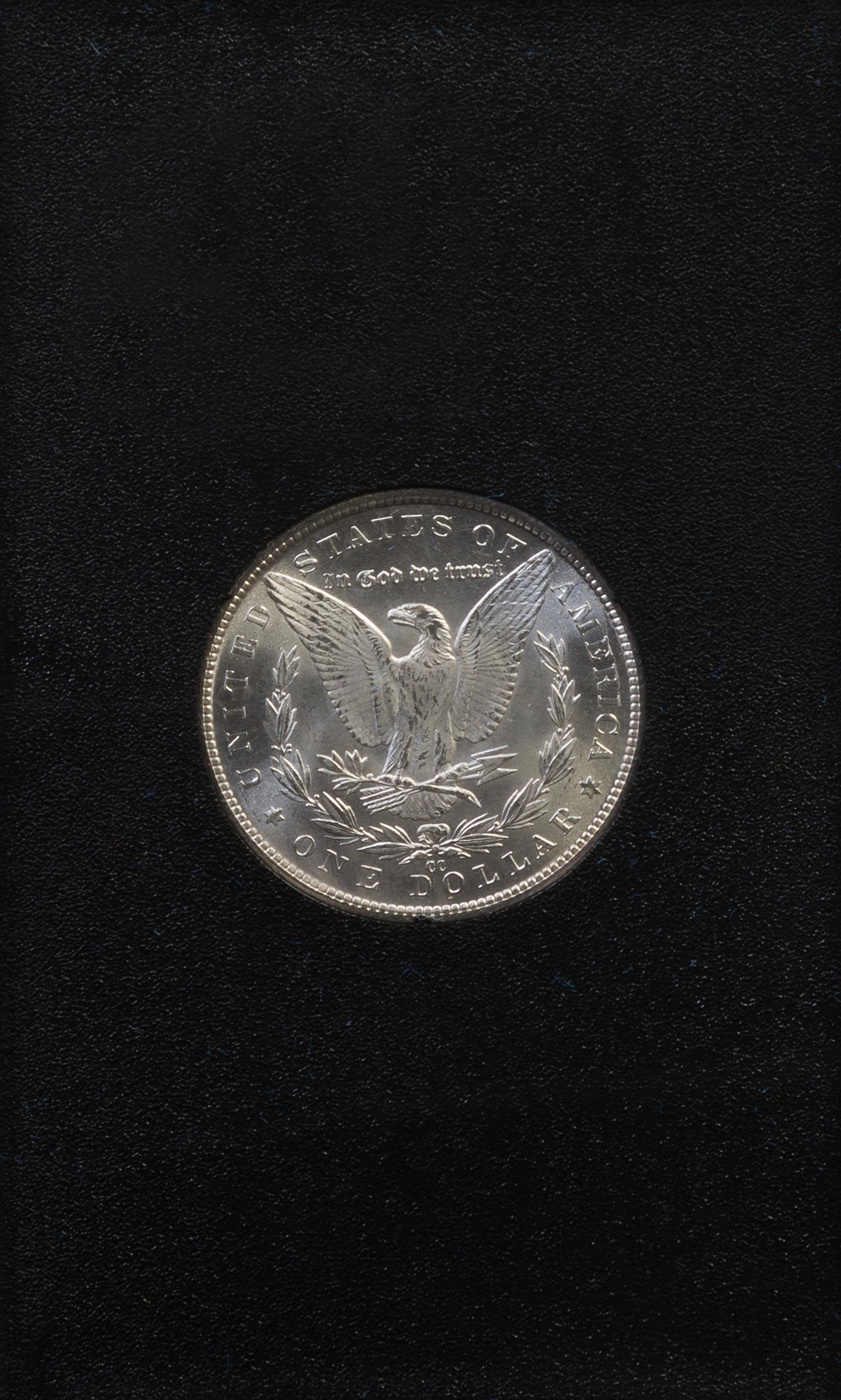 A Group of Four United States 1884-CC GSA Uncirculated Morgan Silver Dollars