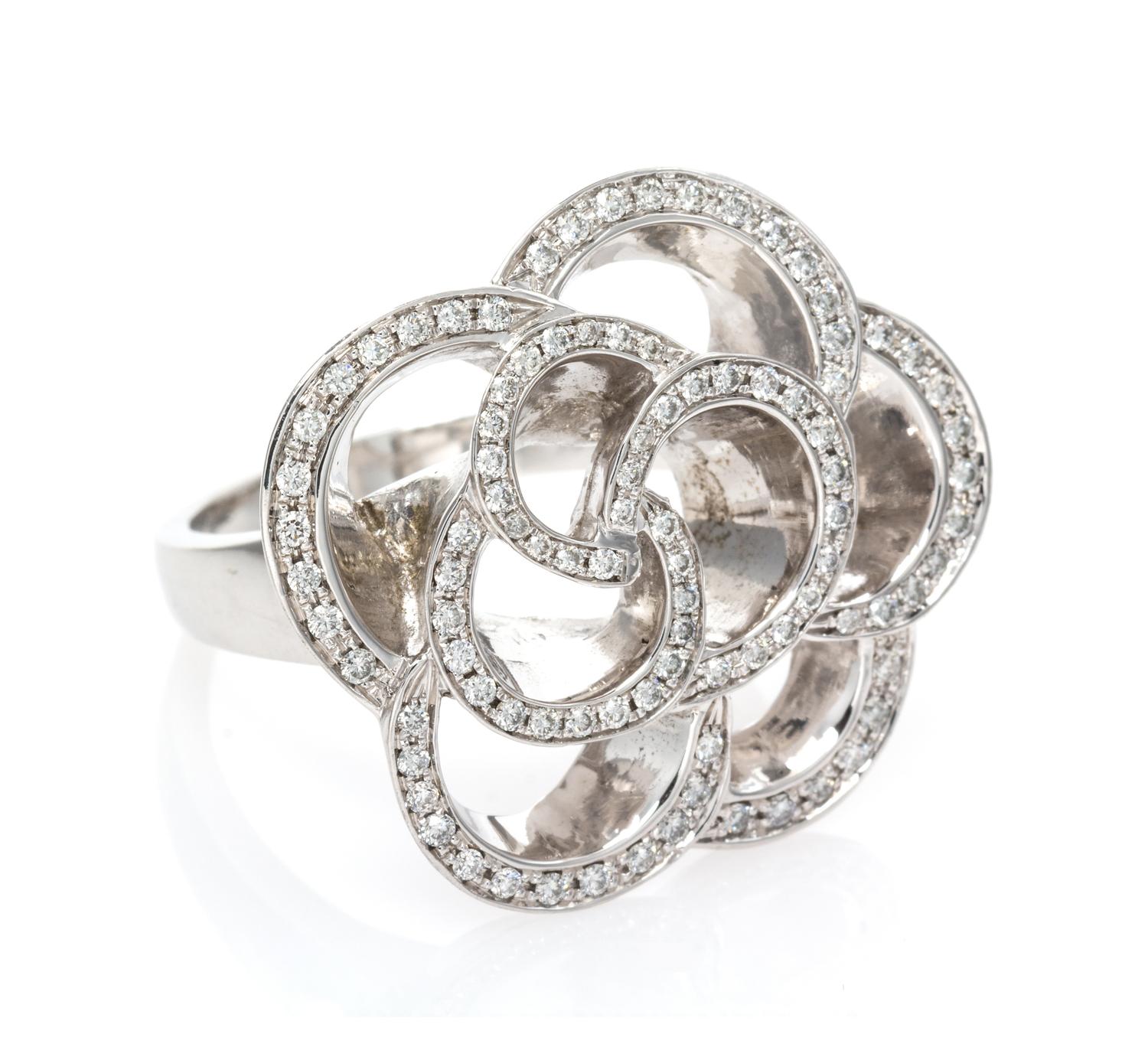 An 18 Karat White Gold and Diamond Floral Motif Ring, 12.15 dwts.