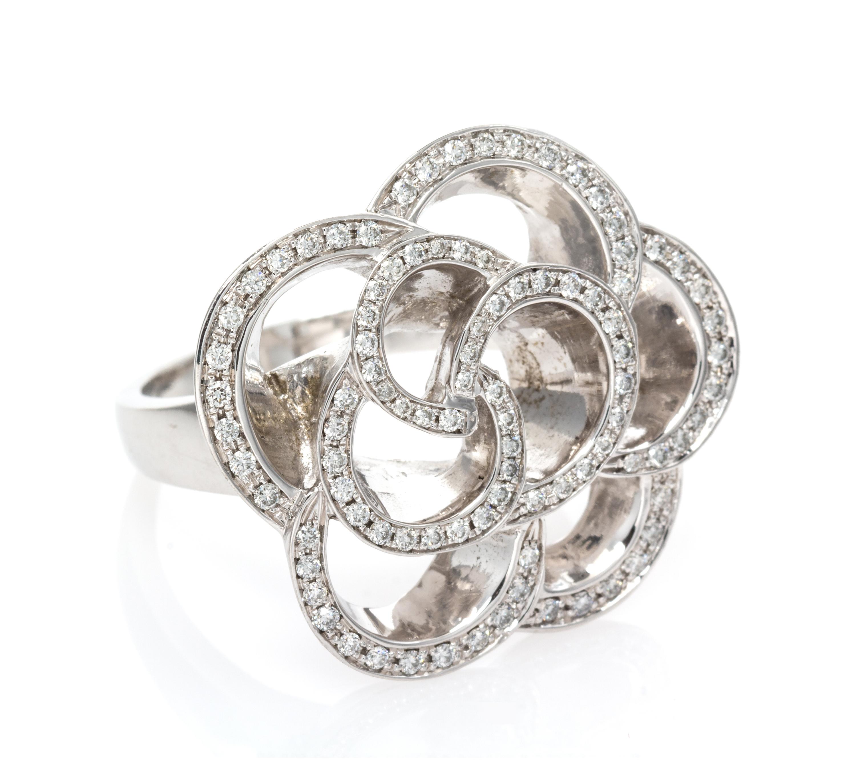 An 18 Karat White Gold and Diamond Floral Motif Ring, 12.15 dwts.